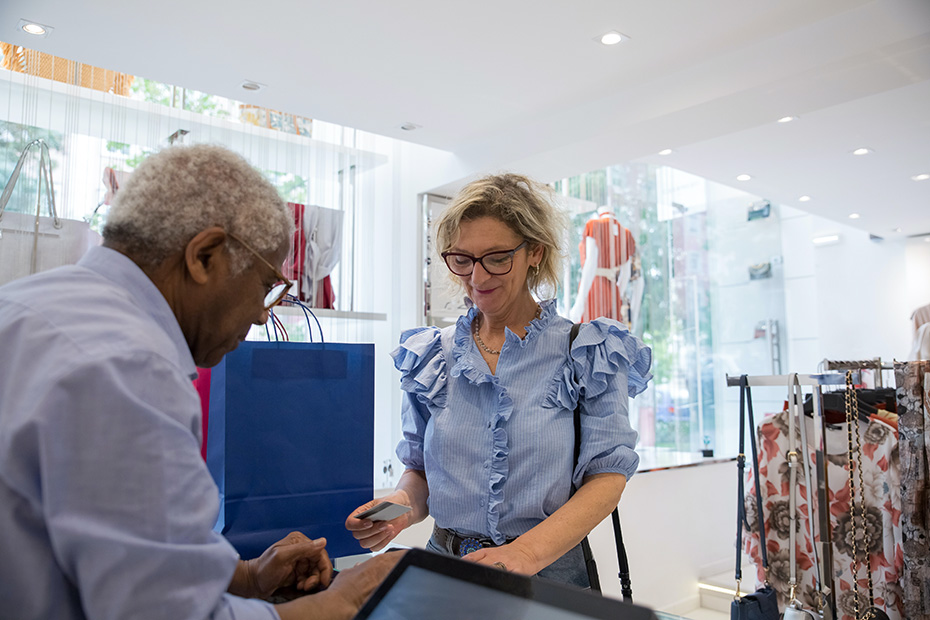 Business woman paying for item with credit card