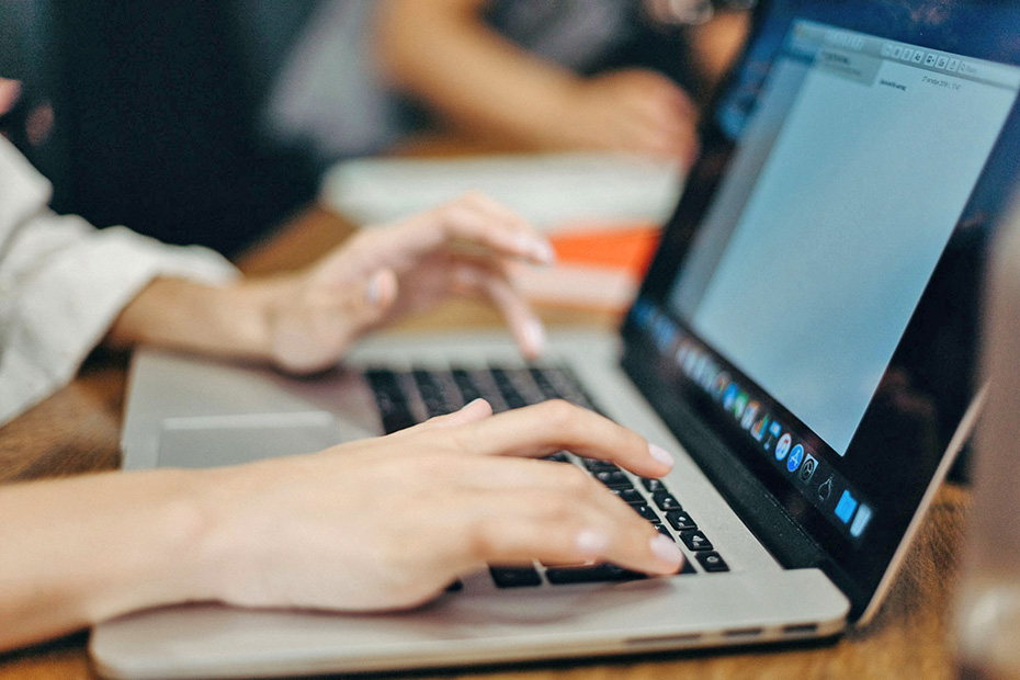 Clos up of a Person's hands typing on a laptop computer