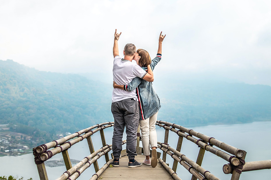 Retired couple on vacation standing on an overlook