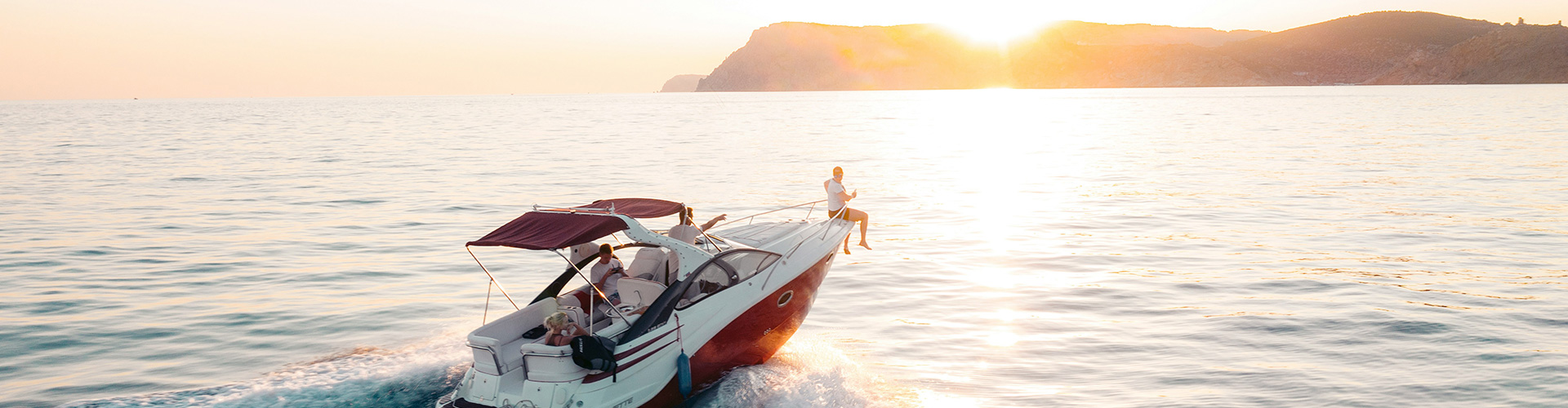 Speedboat riding into the sunset