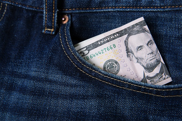 Five dollar bill in jean pocket