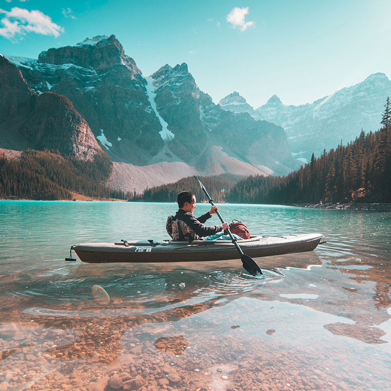 Man kayaking in the mountains