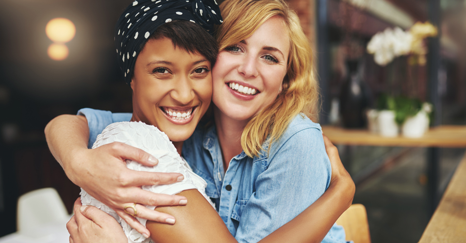 Friends giving each other a hug