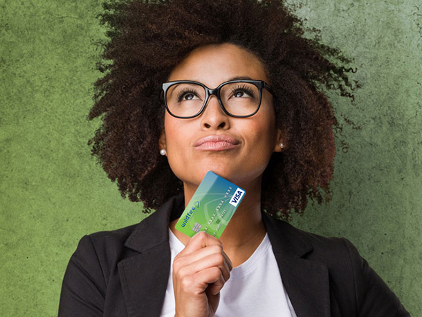 confident female business employee holding Wildfire Credit Card