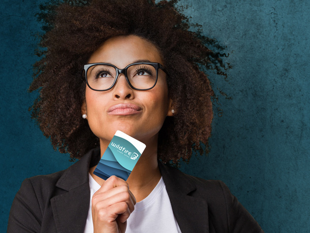 Woman with a credit card looking on confidently