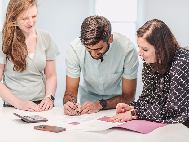 man and his wife signing a document