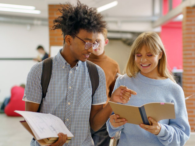 Young Man and Woman Having A Conversation At School