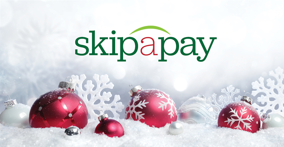 Skip-A-Pay red and white Christmas ornaments in snow