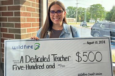 Laurin Cereske holding a check