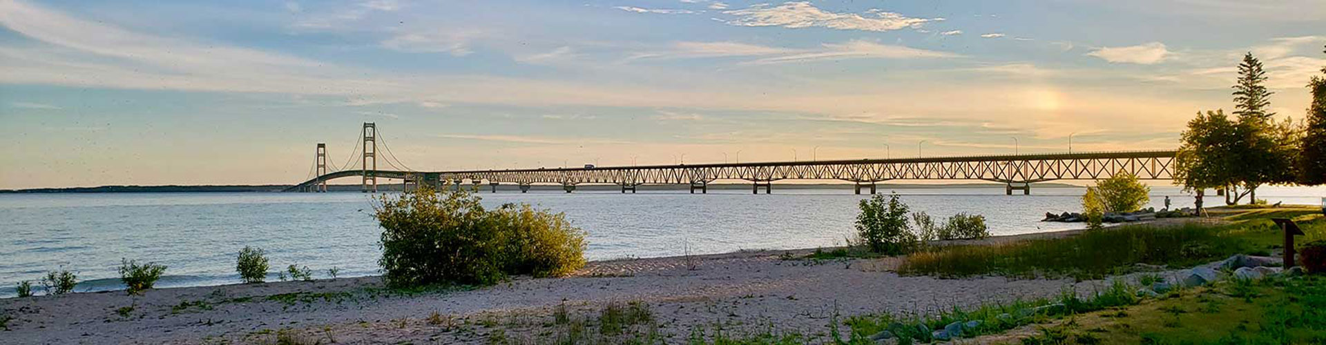 Mackinac Bridge at sunset over Lake Huron